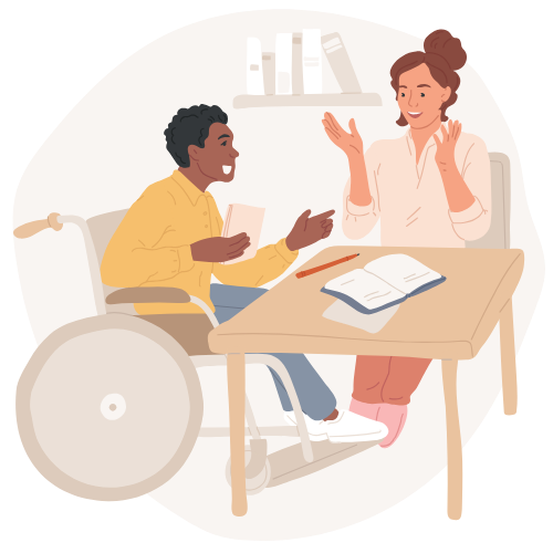 An educator and a student in a wheelchair excitedly talk over a desk.